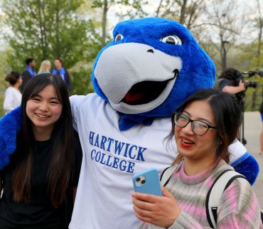 bird mascot and students