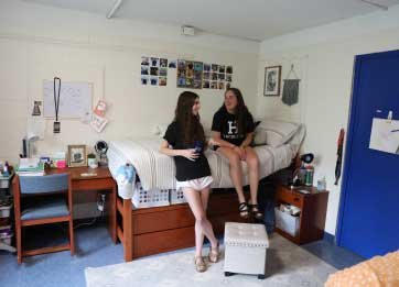 students relax in dorm room