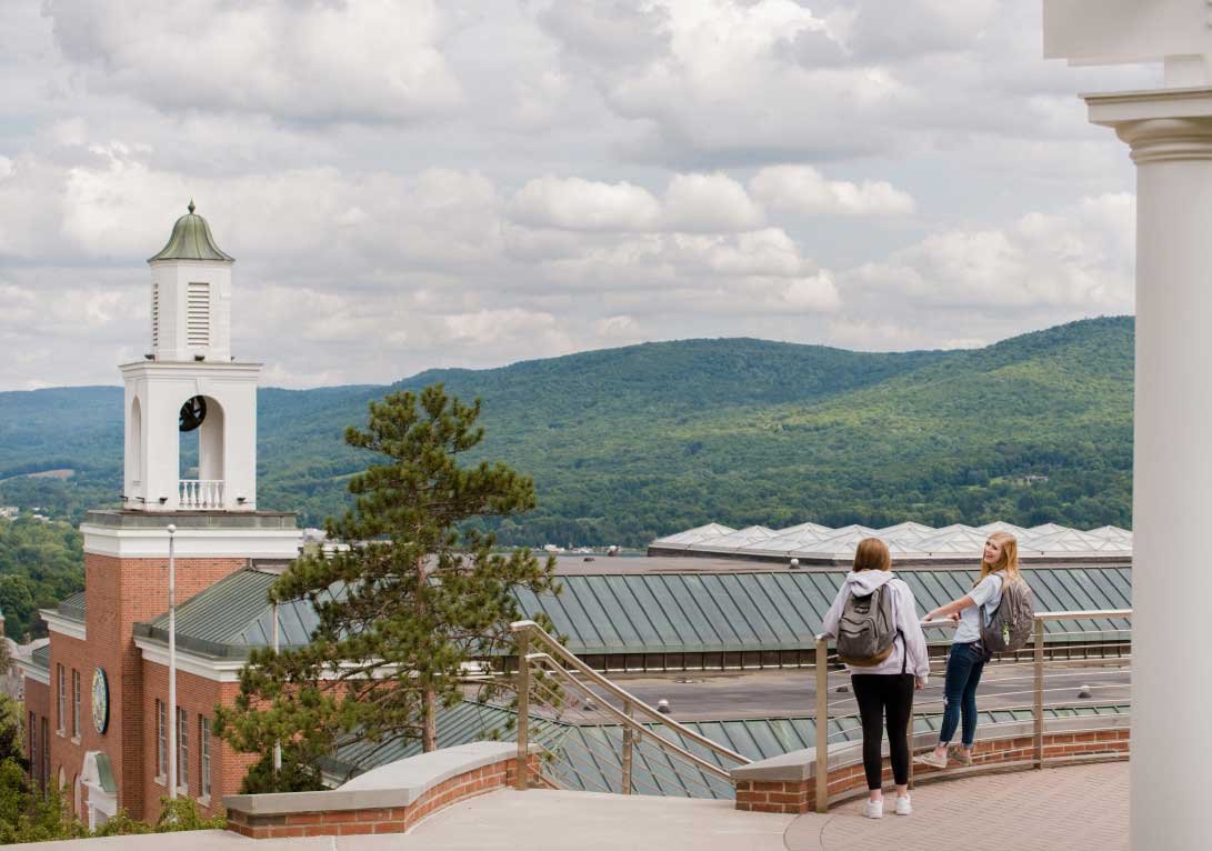 students on balcony overlooking campus