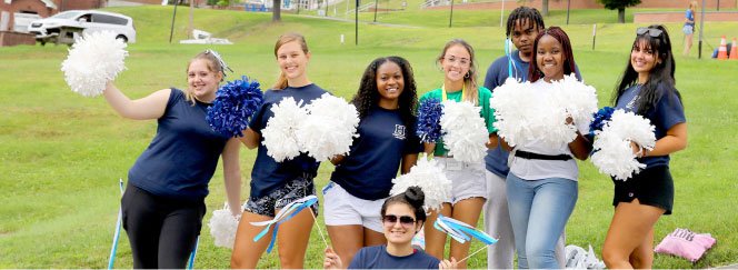 cheerleaders pose for photo